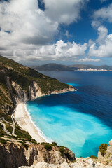 Aerial view at Myrtos Beach and fantastic turquoise and blue Ionian Sea water. Greek islands. Top view, summer scenery of famous and extremely popular travel destination in Cephalonia, Greece, Europe.