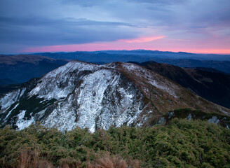 Landscape on the morning. High mountains. Meadows covered in snow. Snowy background. Nature scenery. Location place the Carpathian, Ukraine, Europe.