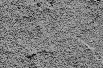 Texture of a concrete wall with cracks and scratches which can be used as a background