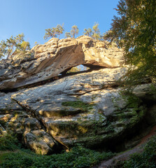 Landscape with beautiful mountains. The lawn is enlightened by the sun rays. Fantastic summer day. Picturesque resort.