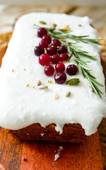 Christmas cake with white icing and cranberries