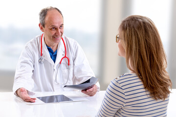 Fototapeta premium Young woman visiting radiologist for x-ray exam in clinic.