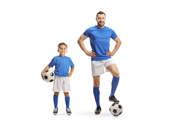 Man and boy with soccer balls wearing same color jersey