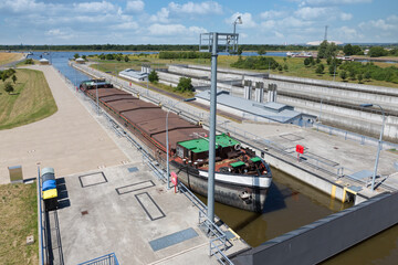 German sluice near Magdeburg with cargo ship in lock chamber