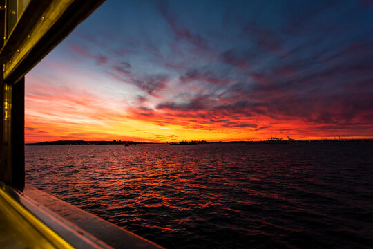 Sunset over the sea through a ferry window