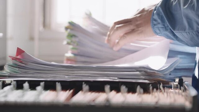 Close up of an officer looks for document in the drawer	