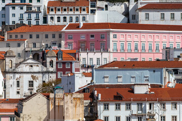 Fototapeta na wymiar Building facades in the center of Lisbon fill the urban scene with historic and traditional architecture.