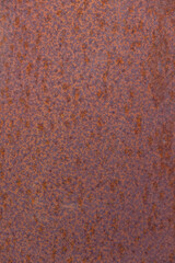 Round rusty background. Corrosion of metal. Outdoor. Selective focus. Vertical image. Copy space.