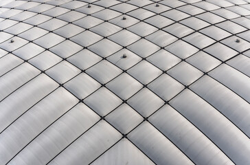 Texture background depicting a close up photography on the air-supported dome-shaped roof of a pressurized inflatable superstructure of a dome stadium.