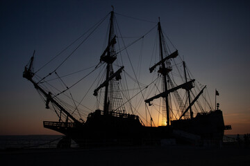 Pirate Sailing Ship Silhouette at Sunset.
