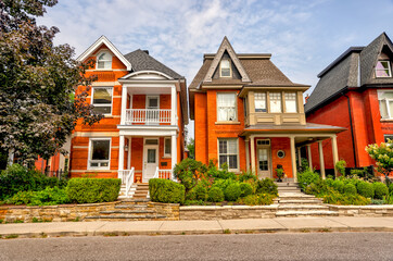 Elegant houses in the Glebe neighbourhood of Ottawa in the Victorian and Arts and Crafts...