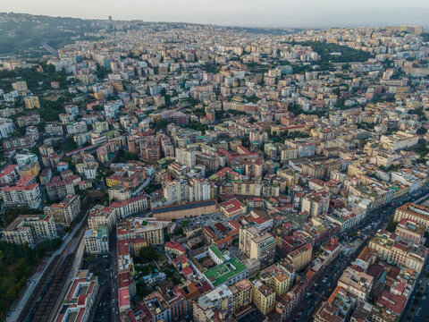 Aerial view of Naples downtown at sunset, view of the high density residential area on hillside, Naples, Italy.
