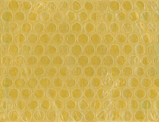 yellow bubble wrap plastic and paper texture background