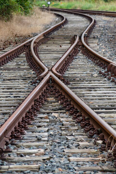 Old rusty train tracks with a switch