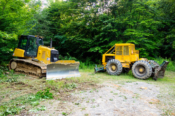 Forest tractor for logging after sawing trees, heavy forestry equipment