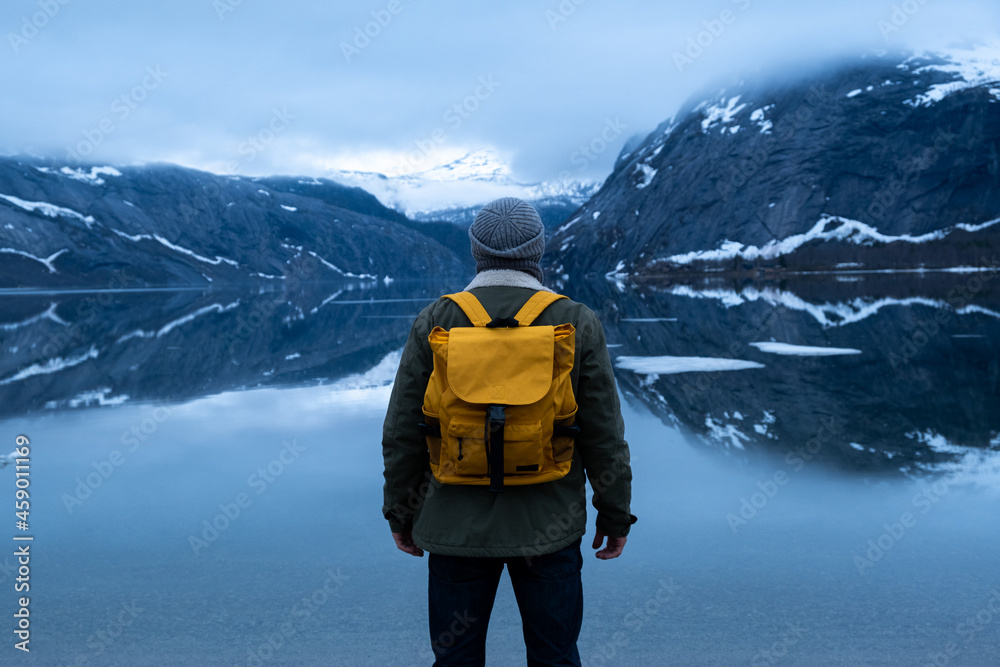 Wall mural man tourist with standing of great mountain scandinavia nature