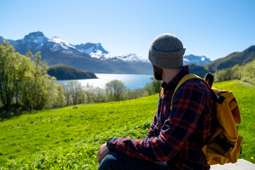 Man Hiker with backpack enjoying view