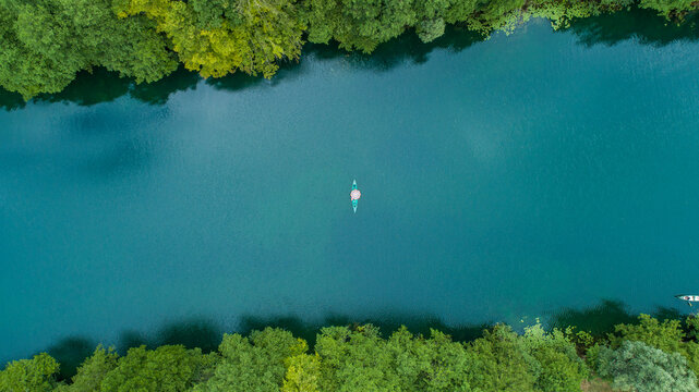 Aerial view of a kayak crossing Mreznica river in Generalski Stol, Karlovac, Croatia.