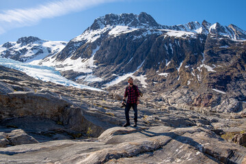 Fototapeta premium Man tourist with standing of great mountain Scandinavia nature