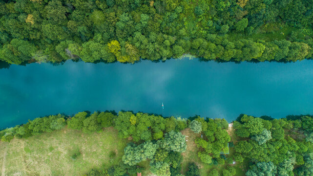 Aerial view of a kayak crossing Mreznica river in Generalski Stol, Karlovac, Croatia.