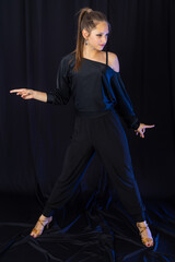 Beauty teen in black latin dance clothes