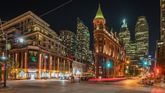 Zoom out timelapse view of cityscape and night traffic in downtown Toronto, Ontario, Canada. 