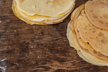 Pancakes close up. Pancakes on wooden background. A stack of pancakes on a wooden stand.