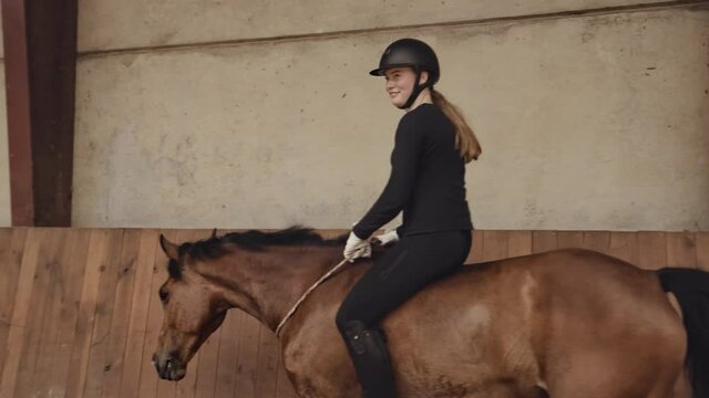 Woman Riding Bareback On Horse Walking Around Paddock