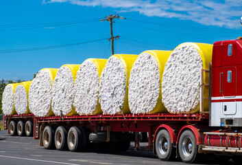 Large bales of cotton strapped to a truck for transport in North Queensland, Australia near...