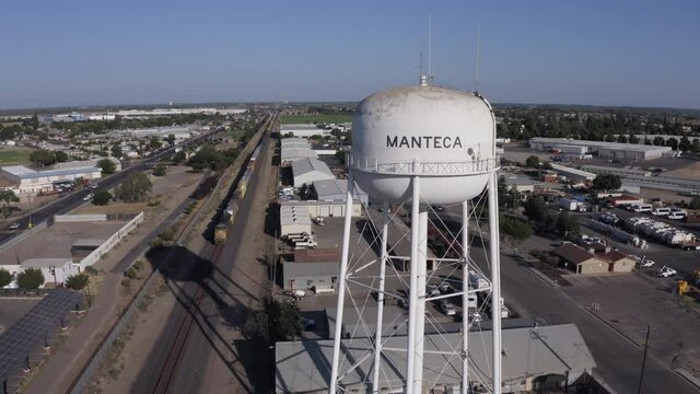 Manteca, California, USA - July 15, 2021: Afternoon sun shines on the city's famous water tower.