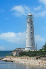 Fototapeta na wymiar Seascape with a view of the white lighthouse