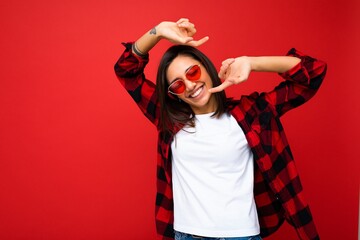 Portrait of positive cheerful smiling young brunette woman in casual white t-shirt for mockup,...