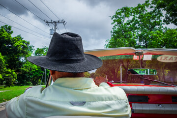 Havana, Cuba, close up of the back of a taxi driver with a hat driving