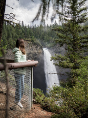 young woman watching waterfalls
