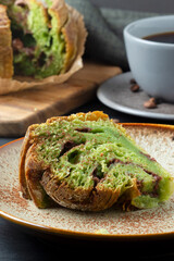 Sliced pistachio brioche with chocolate, selective focus