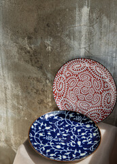 Two ceramics plates on pink table cloth. Ceramic tableware, Beautiful arrangement, Copy space, 