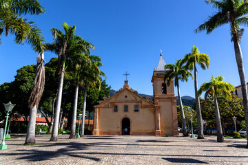 Fototapeta na wymiar Facade of the parish church of Sao Sebastiao, Built in the 17th century of stone and lime, during the Jesuits' era, in city of Sao Sebastiao. north coast of Sao Paulo