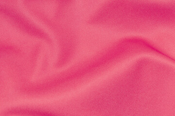 Fototapeta na wymiar Pink color sports clothing fabric football shirt jersey texture and textile background.
