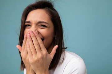Closeup of happy positive young cute nice brunette woman with sincere emotions wearing casual white...