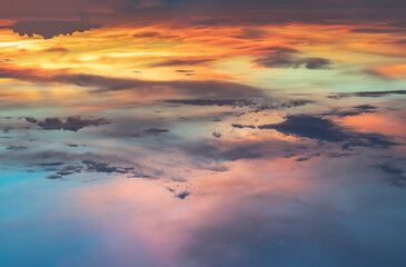 Beautiful sunset sky above clouds with dramatic light, Beautiful blazing sunset landscape, Copy space, Selective focus.