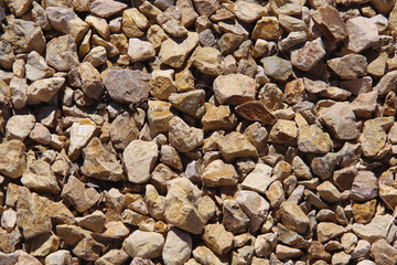 Full frame close-up view of an area of rough sandstone gravel