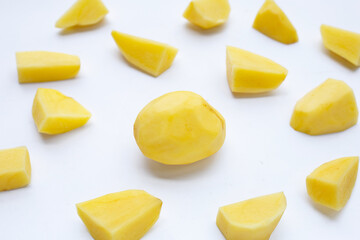 Raw peeled potatoes on white background