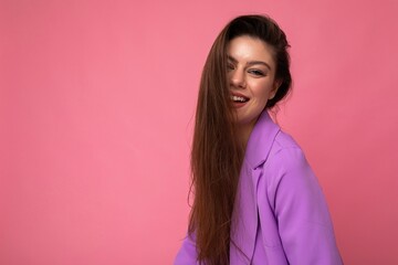 Fototapeta premium Photo of smiling young business woman wearing purple suit isolated on background. Copy space