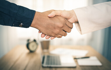 two businessman shake hand after complete success project with teamwork. close up of business man...