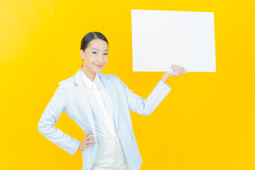 Portrait beautiful young asian woman with empty white billboard