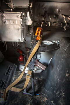 
A Kalashnikov Assault Rifle Is Lying On A Chair Inside The BTR 80