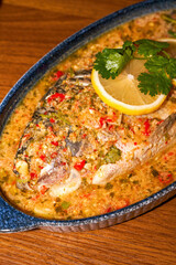 A delicious Thai-style braised sea bass with spicy and sour sauce