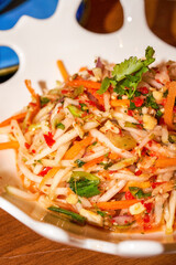 A delicious Thai hot and sour green papaya salad