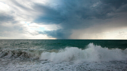 Turquoise sea with waves and foam