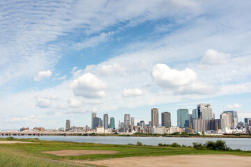 Fototapeta premium View of office buildings of central Osaka city from Yodogawa river bank